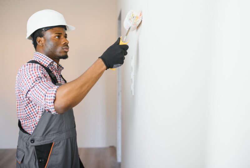 young male electrician install electrical outlets and switch young male electrician install electrical outlets and switch